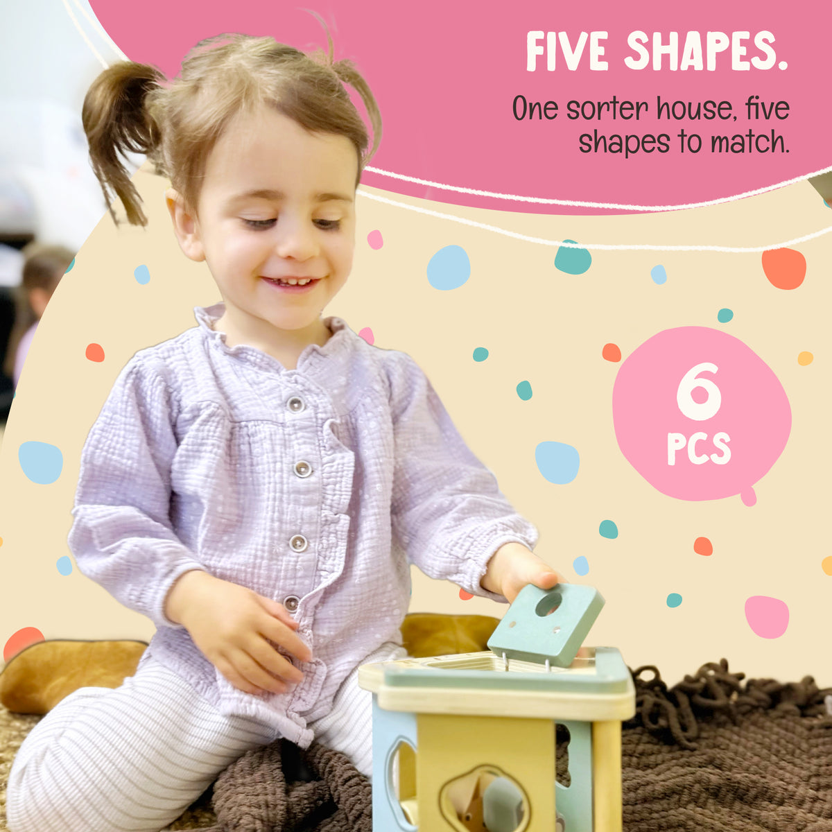 Toddler opening door of the OmaOmaOma wooden shape sorter — classic Montessori sorting toy in FSC-certified wood