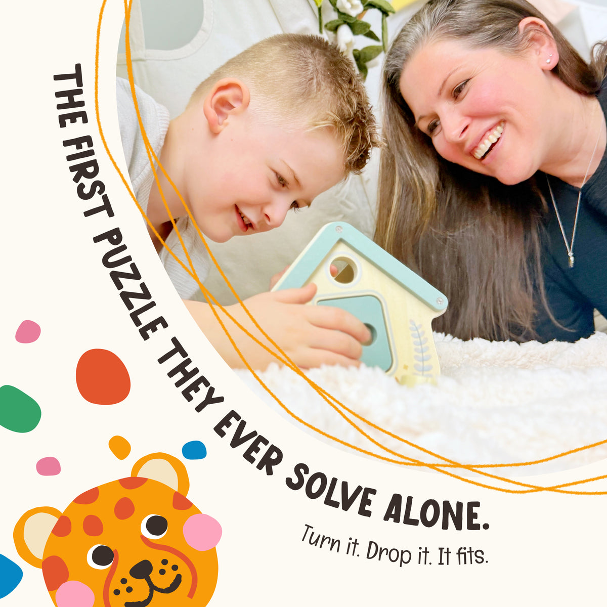 Mother and toddler working through the OmaOmaOma wooden shape sorter together