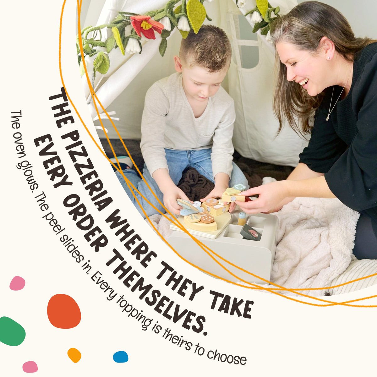 Parent and child playing together at the OmaOmaOma wooden play kitchen — shared pretend cooking
