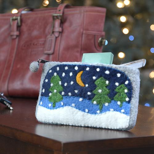 Our silent night winter clutch is a winter outfit staple!